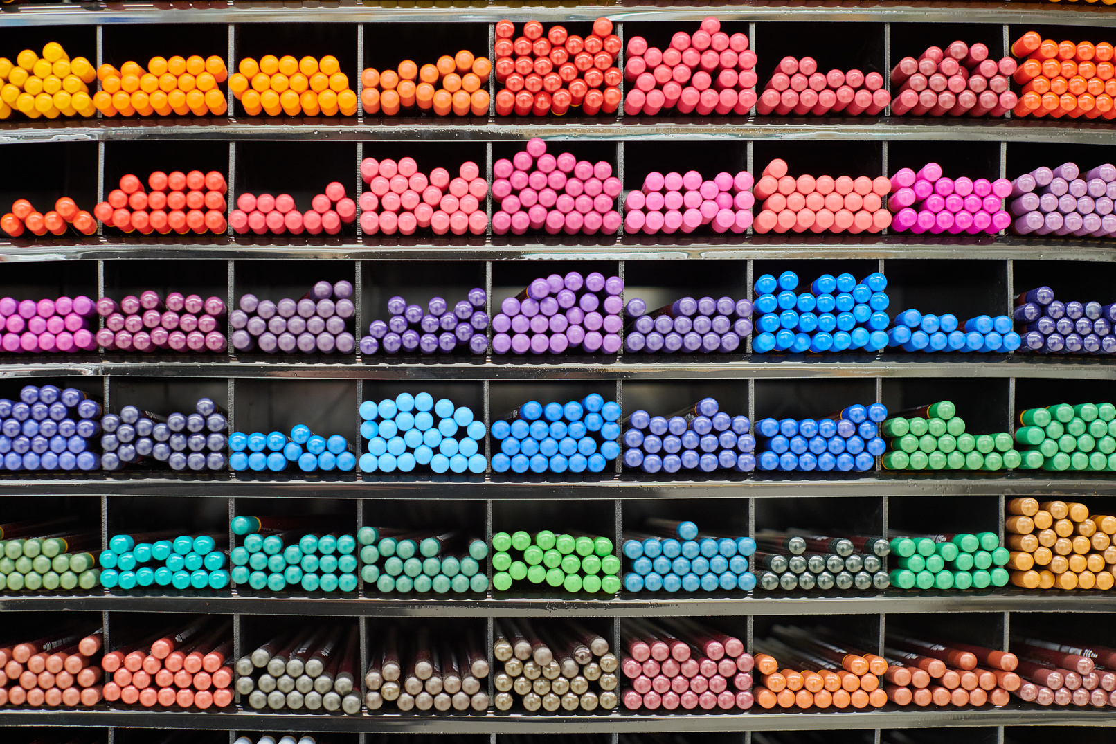 Colored Pens, Pencils, Markers on Shelf in Stationery Shop